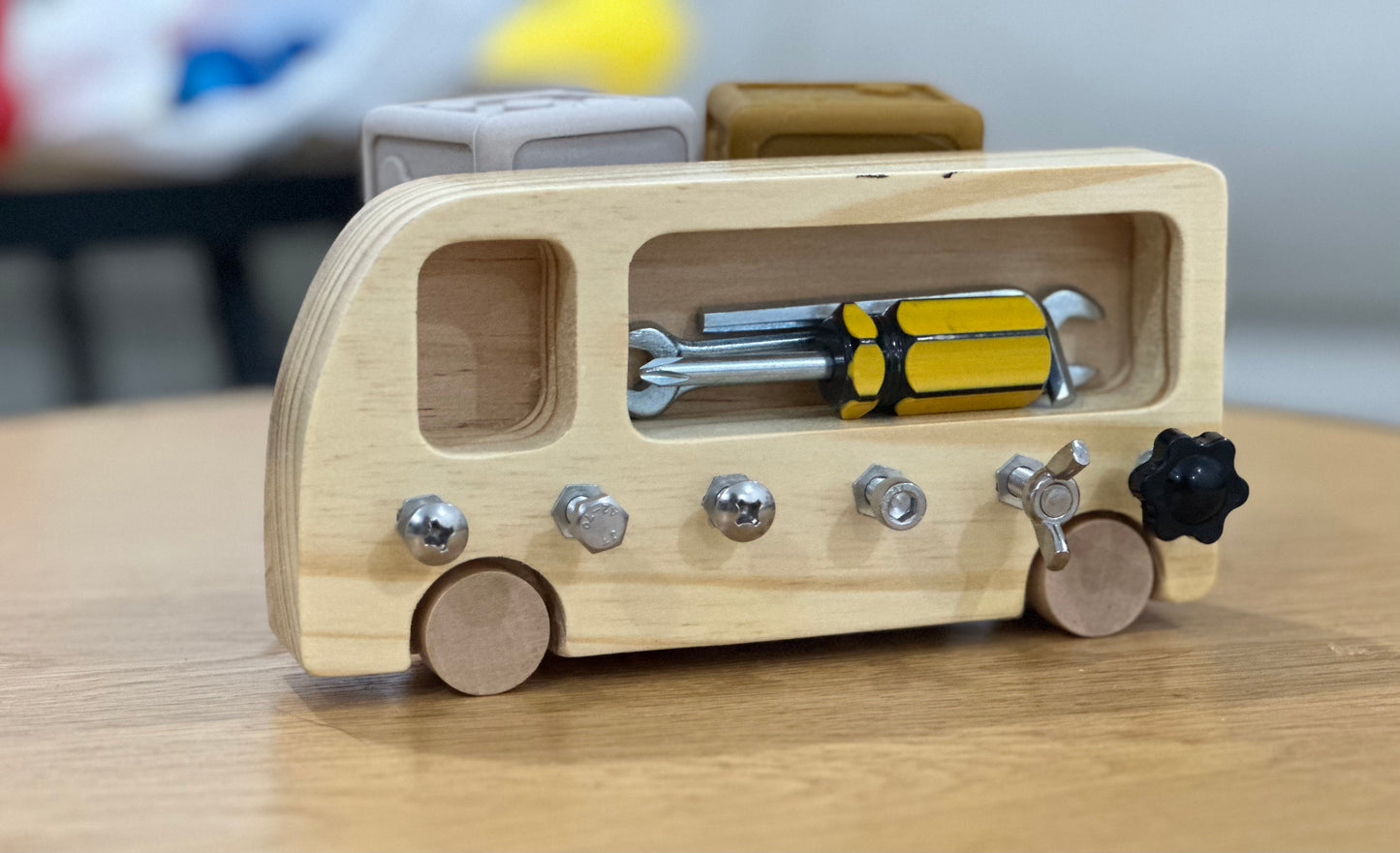 A screw game for a child - in the shape of a bus