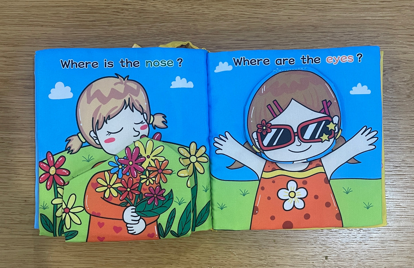 A soft book for a baby - learning parts in English