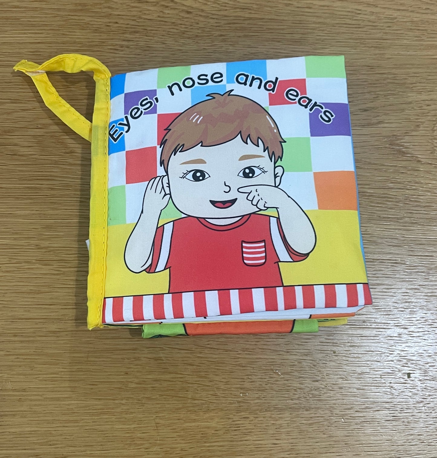 A soft book for a baby - learning parts in English